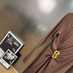 Jersey maxi dress with metallic decor at the waist