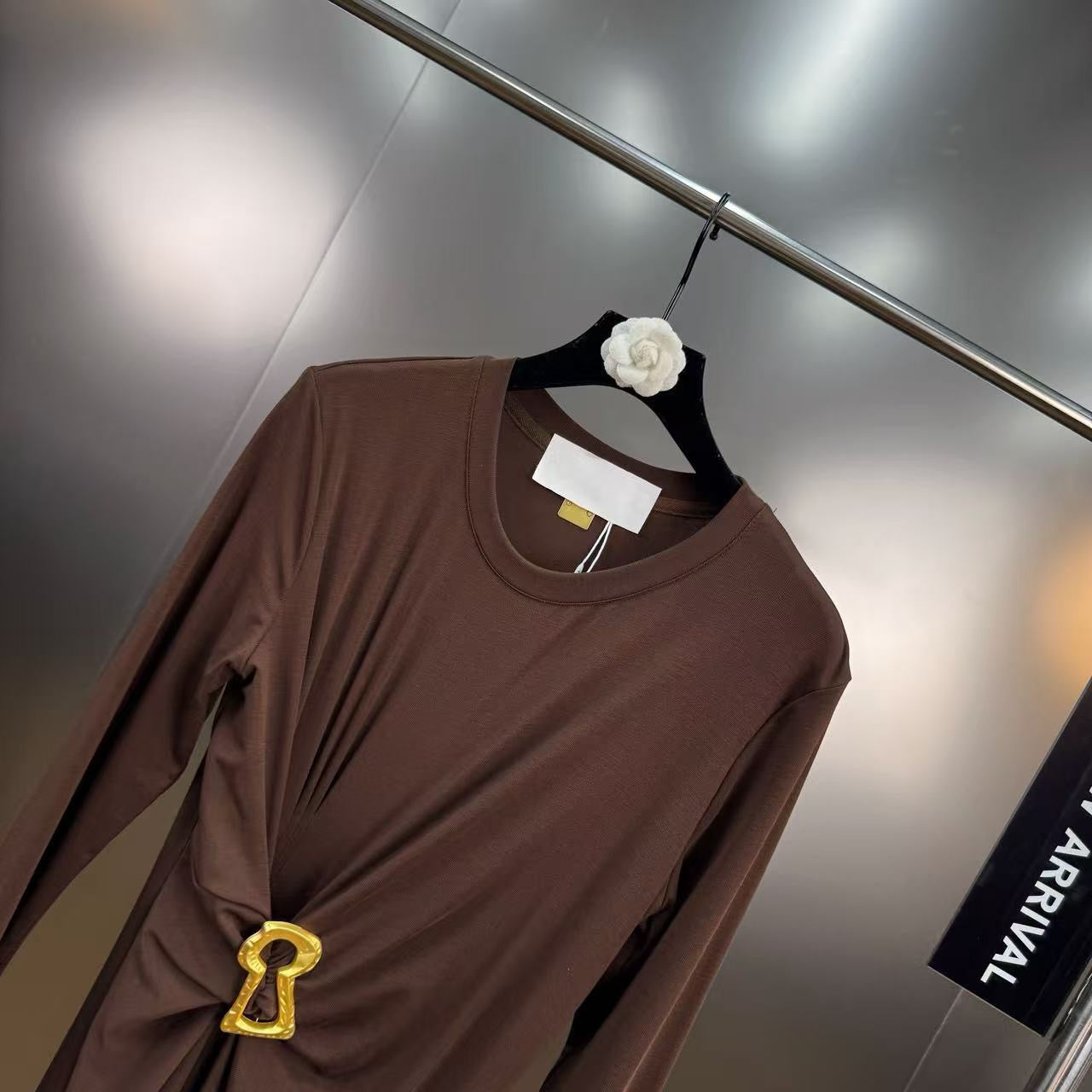 Jersey maxi dress with metallic decor at the waist