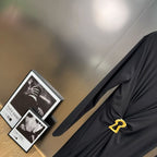 Jersey maxi dress with metallic decor at the waist