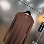 Jersey maxi dress with metallic decor at the waist