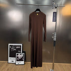 Jersey maxi dress with metallic decor at the waist