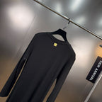 Jersey maxi dress with metallic decor at the waist